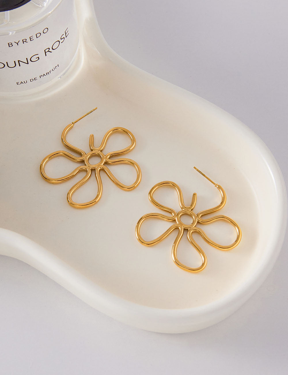 Slim Hollow-Out Flower Stud Earrings — gold earrings