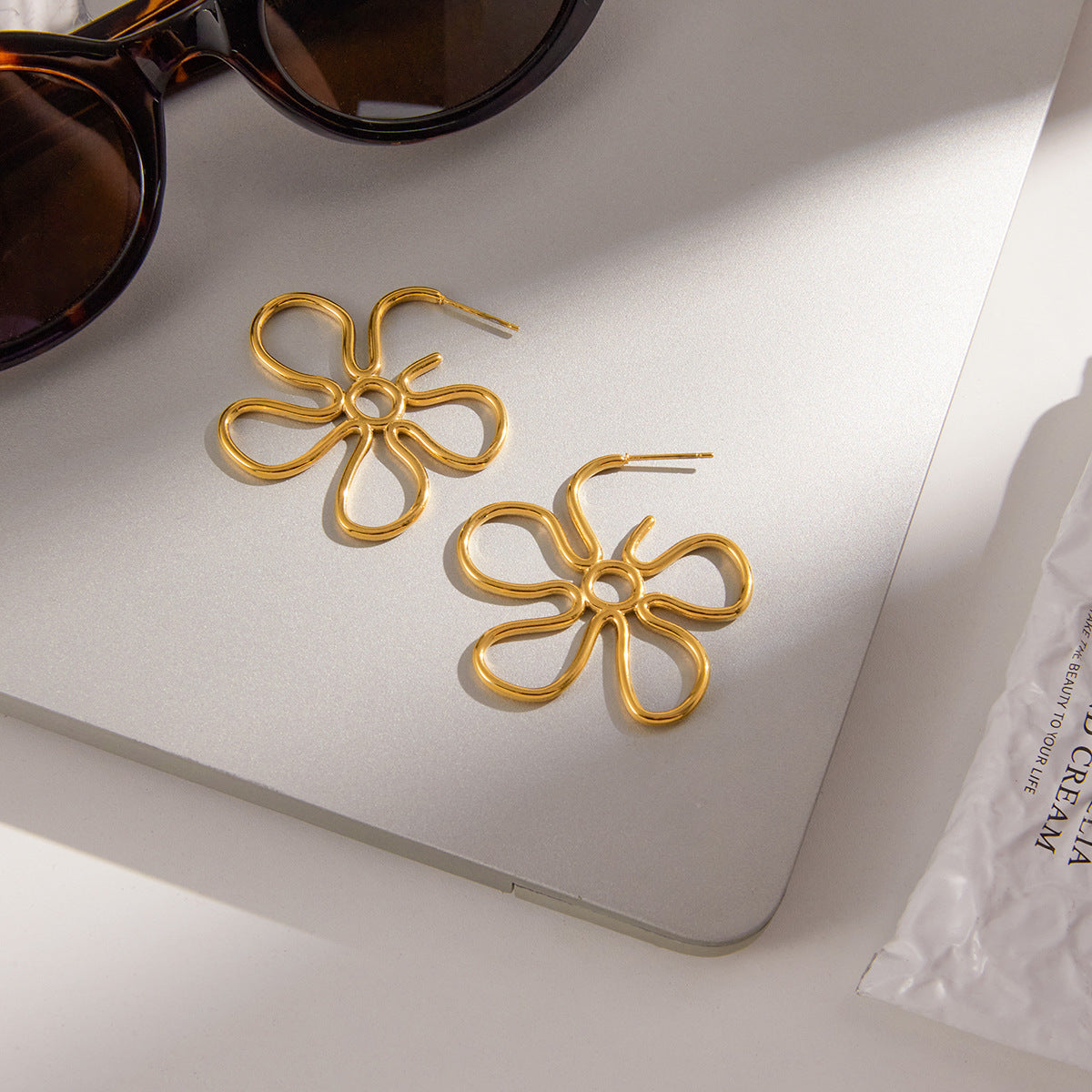 Slim Hollow-Out Flower Stud Earrings — gold earrings, view 3