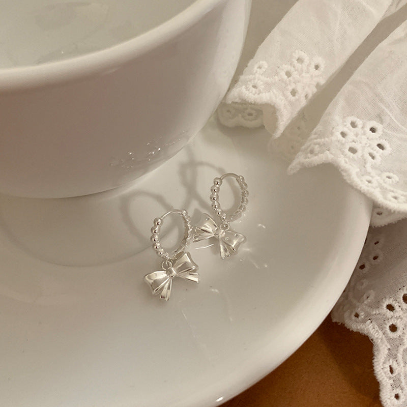 Bow Knot Huggie Hoop Earrings — silver earrings, view 2