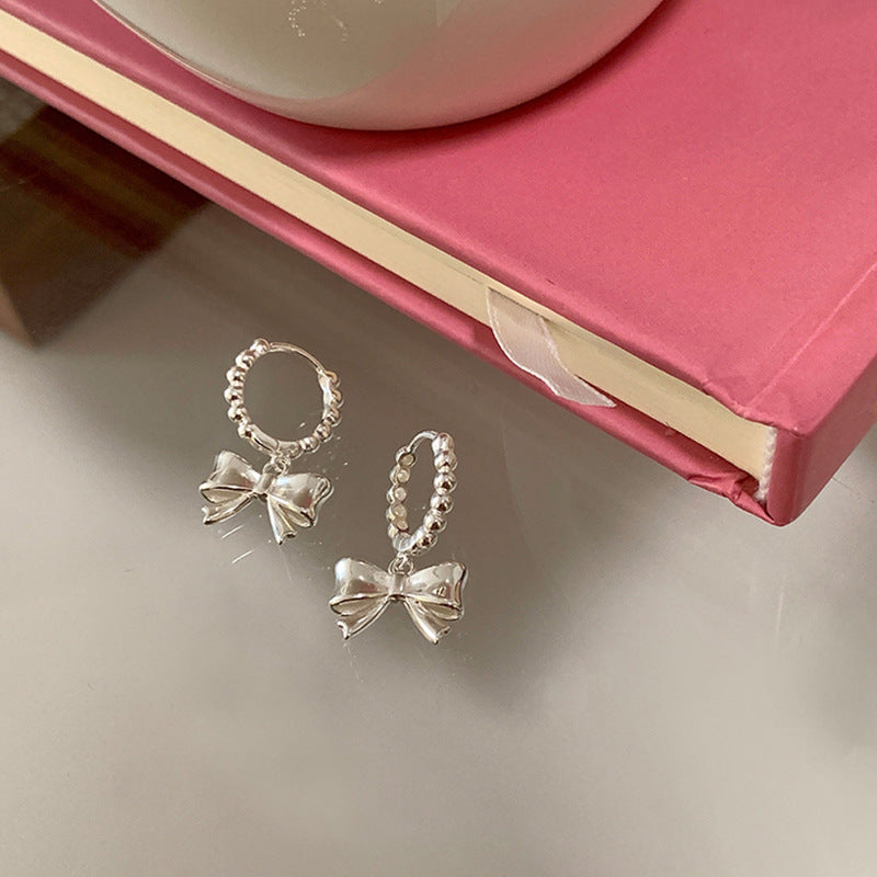 Bow Knot Huggie Hoop Earrings — silver earrings, view 4