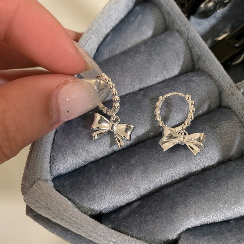 Bow Knot Huggie Hoop Earrings — silver earrings, view 5
