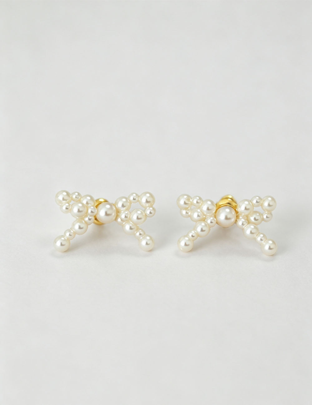Bow Knot Imitation Pearl Studs — earrings