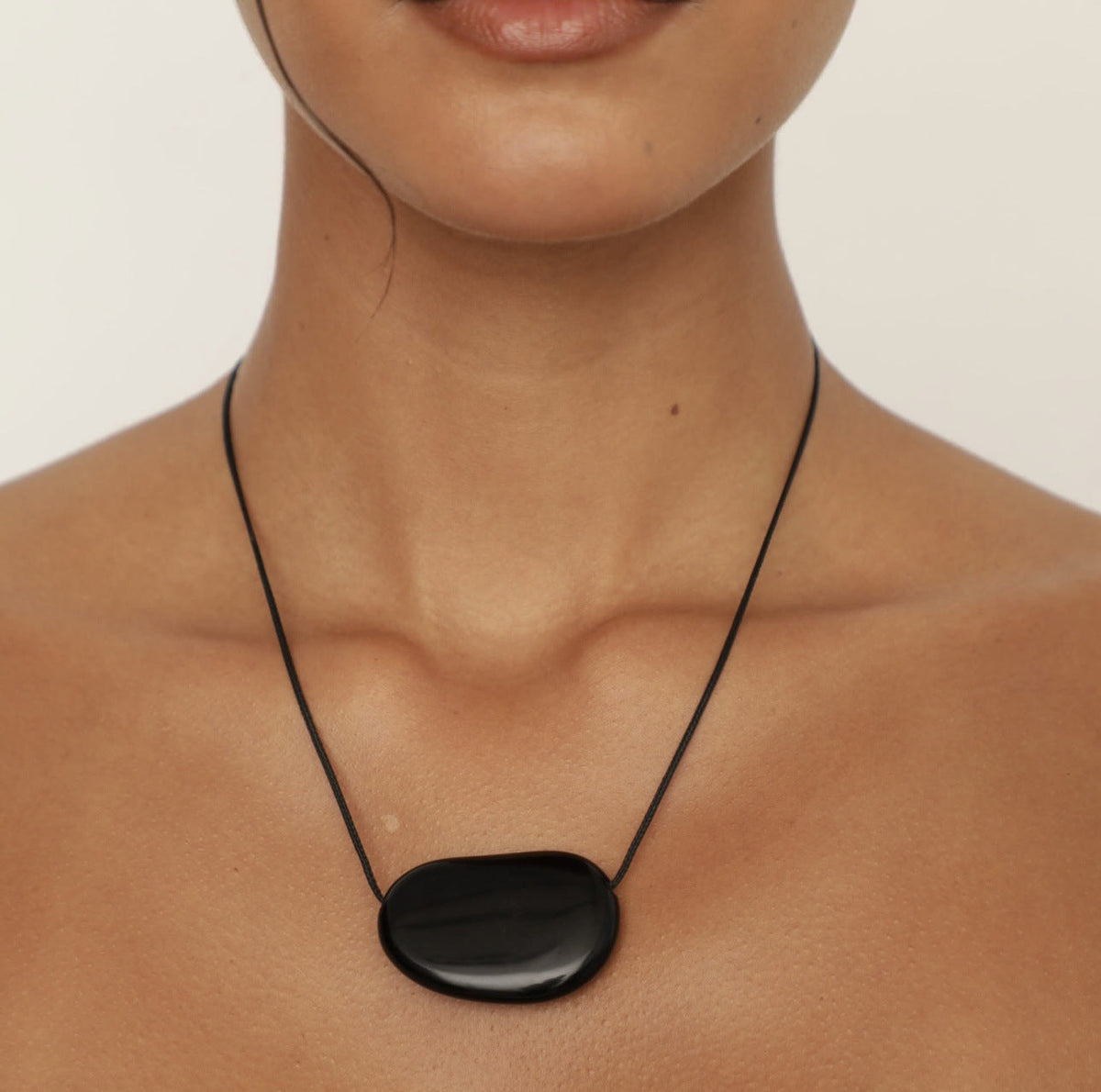 Polished Crystal Pendant Necklace — black necklace, view 2